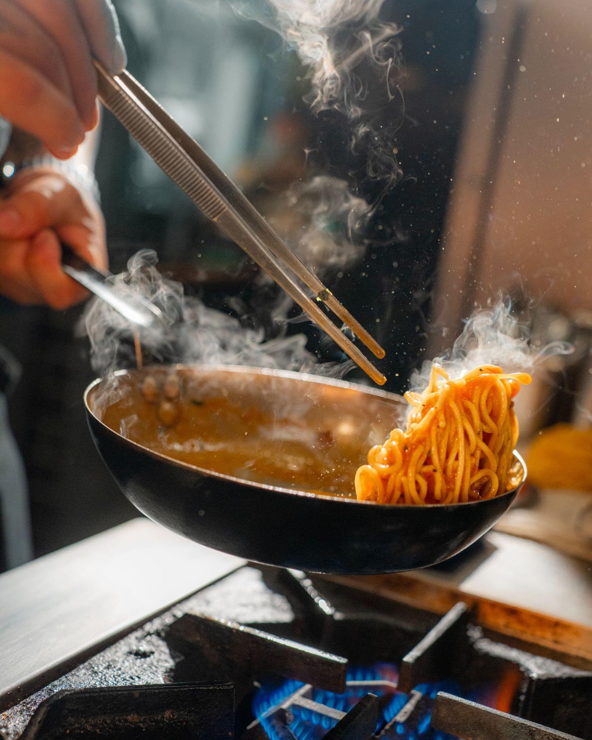 Chef preparing noodles for food and beverage content